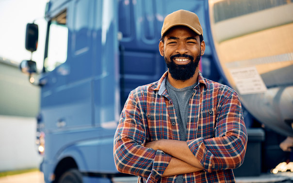 Confident truck driver smiling at camera